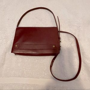 Madewell leather burgundy cross body with mirror, zipper pouch & inside pocket.